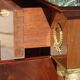 Flamed mahogany enfilade with sea green marble in Empire style.
