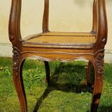 Former seat, wood and caning.