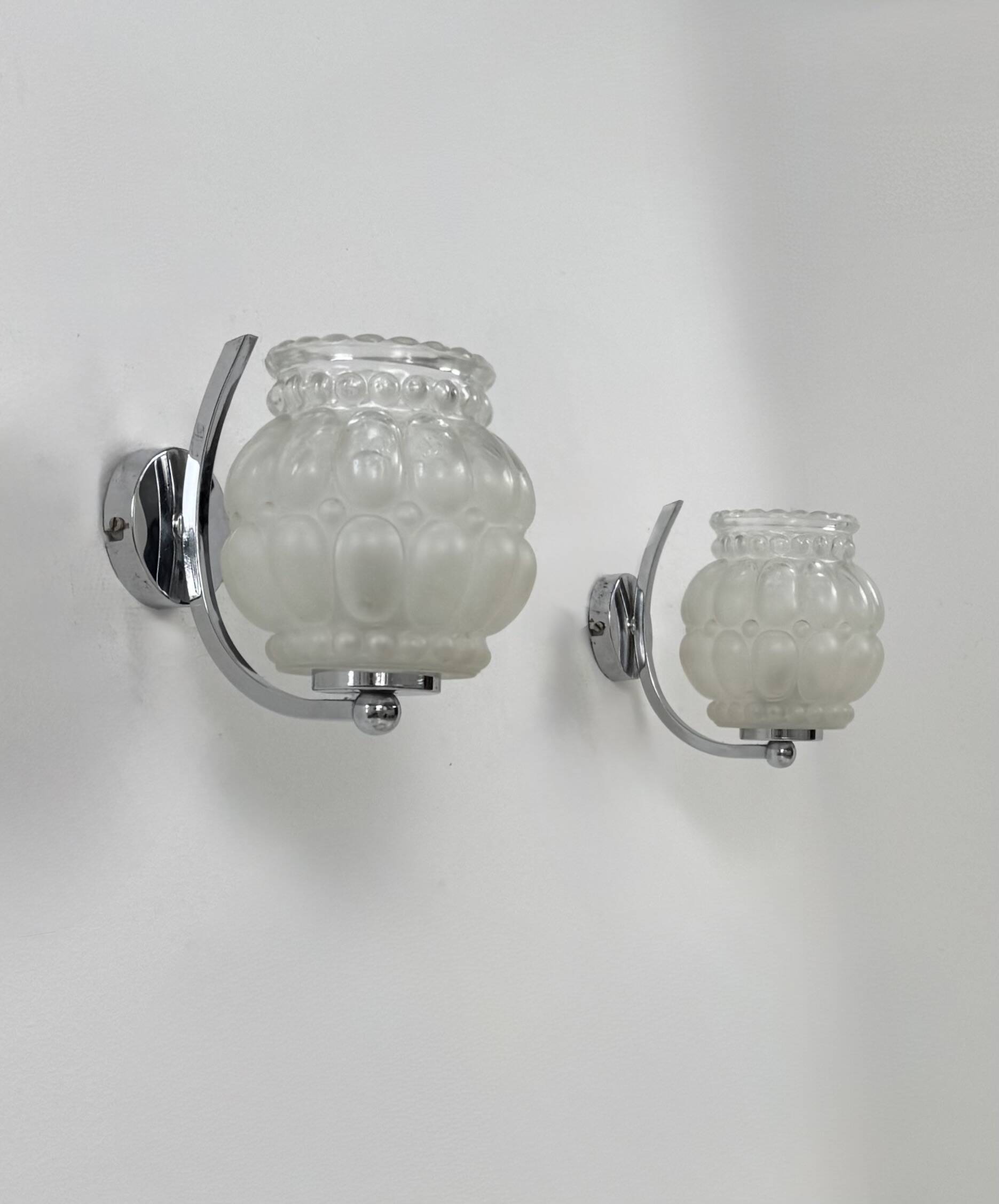 Pair of vintage chrome metal and bubble glass wall lights, France, 1950.