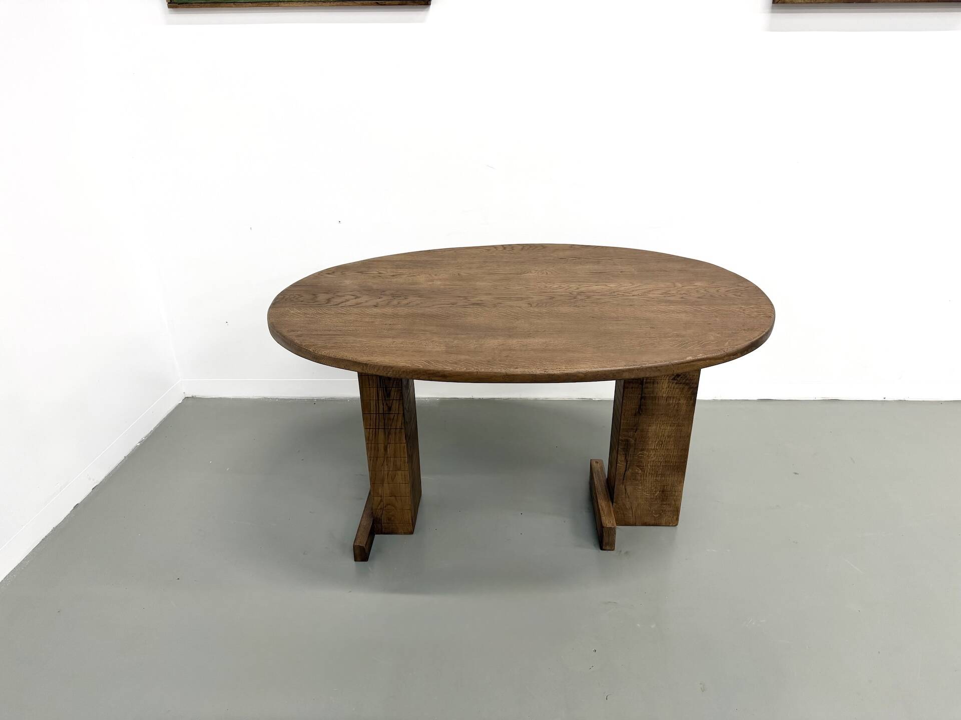 Oval table with T-shaped legs, solid oak, student woodworking project.