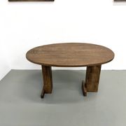 Oval table with T-shaped legs, solid oak, student woodworking project.