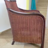 Vintage colonial-style armchair in woven rattan and exotic wood
