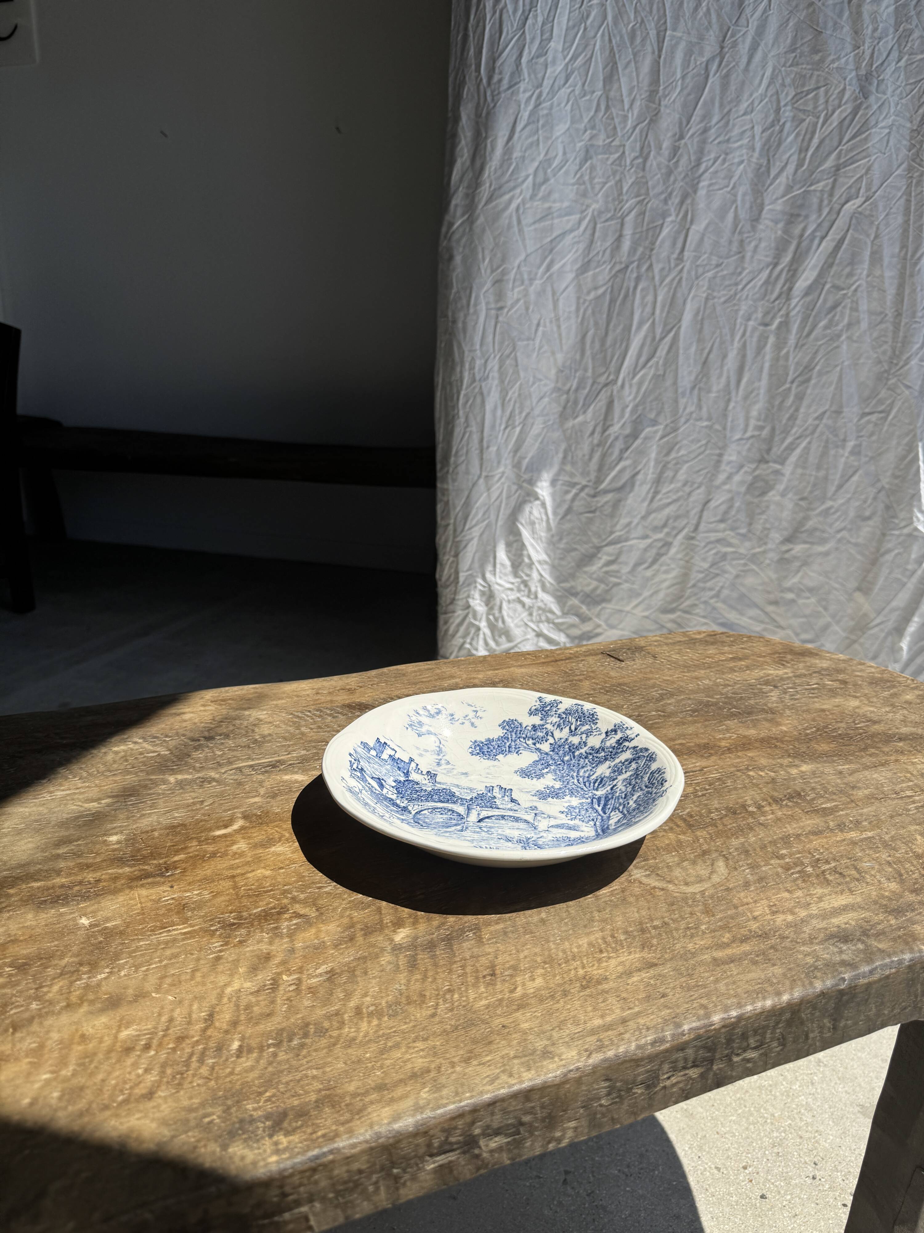 Small deep Gien earthenware plate with blue landscape motif D21.5