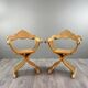 Pair of Renaissance-style folding armchairs, early 20th century