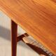 Vintage Scandinavian coffee table in teak and rattan – Danish design from the 1960s.
