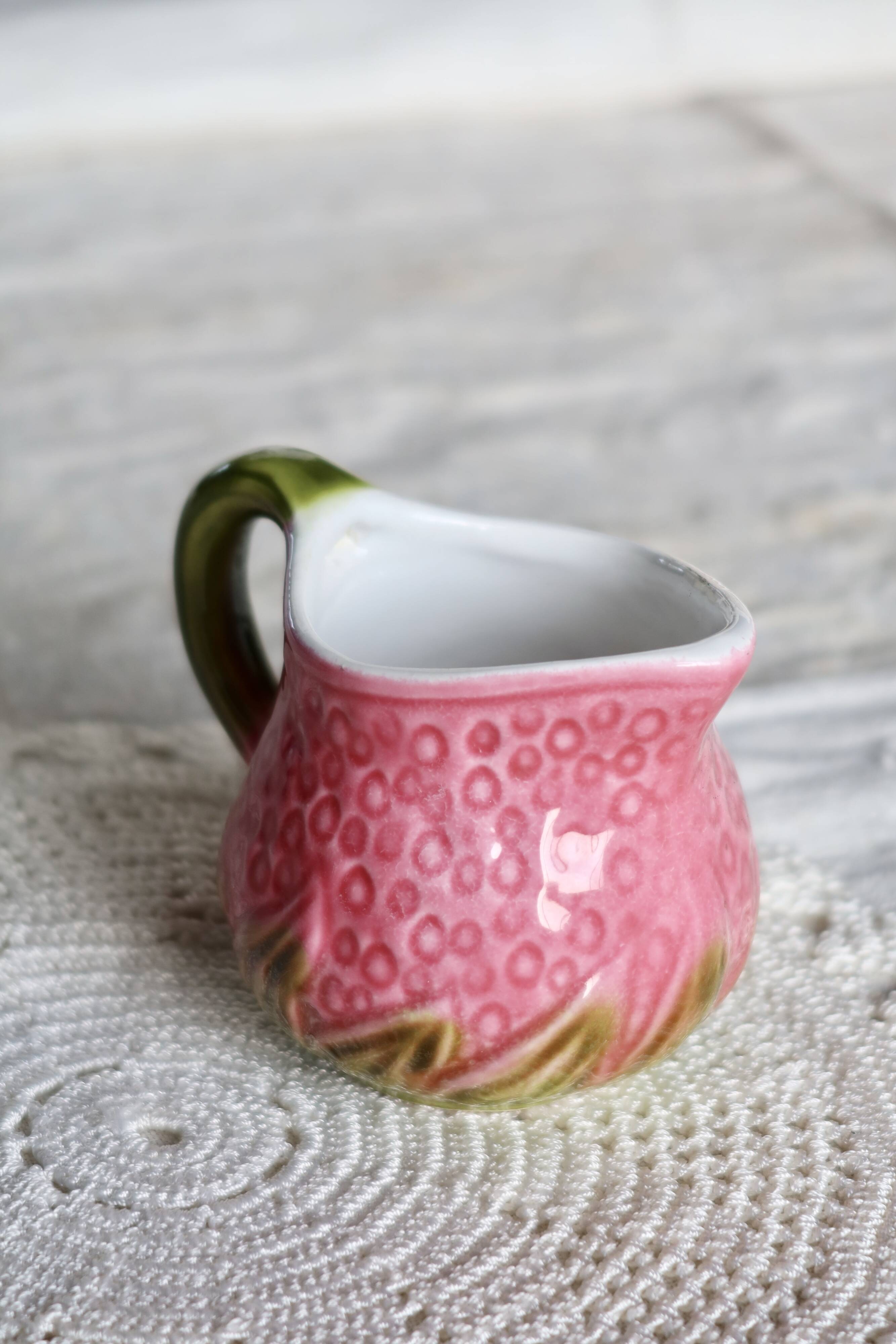 Vintage milk jug in Italian faience majolica.