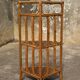 Varnished rattan corner shelf