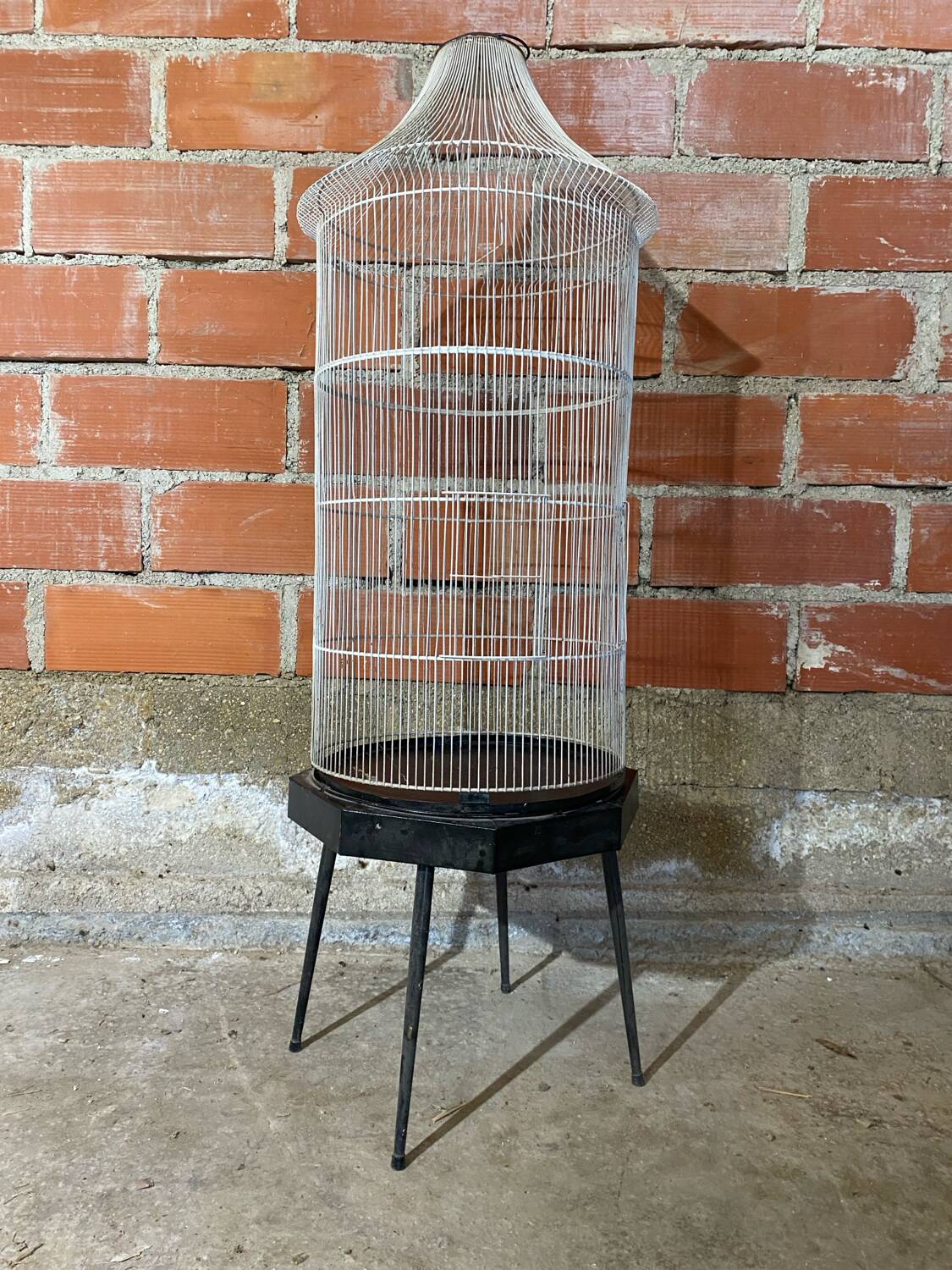 Antique black & white metal bird cage on vintage decorative legs
