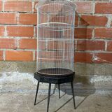 Antique black & white metal bird cage on vintage decorative legs