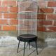 Antique black & white metal bird cage on vintage decorative legs
