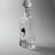 Vintage glass decanter from the 1980s, transparent glass with a silver plate and spherical stopper.