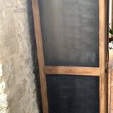 Vintage wooden wardrobe with matte cast iron color hanging rail