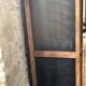 Vintage wooden wardrobe with matte cast iron color hanging rail