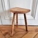 Tripod stool in raw wood