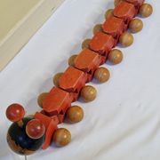 Vintage pulling toy, "centipede", 82 cm, made in Switzerland