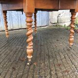 Round table in solid cherry wood, extendable with twisted legs, Louis Philippe style.