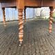 Round table in solid cherry wood, extendable with twisted legs, Louis Philippe style.