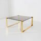 Mid-century coffee table with gold plated base and glass top, 1970s
