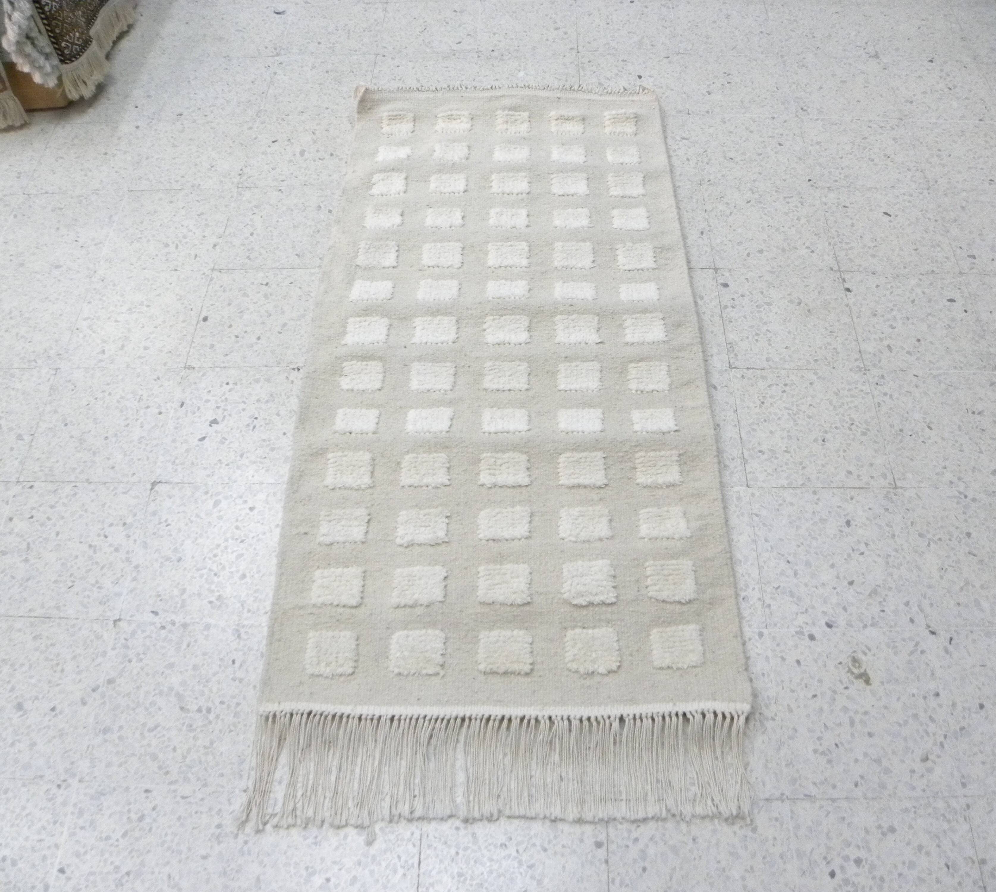 Tunisian Berber rug handwoven from pure sheep wool.