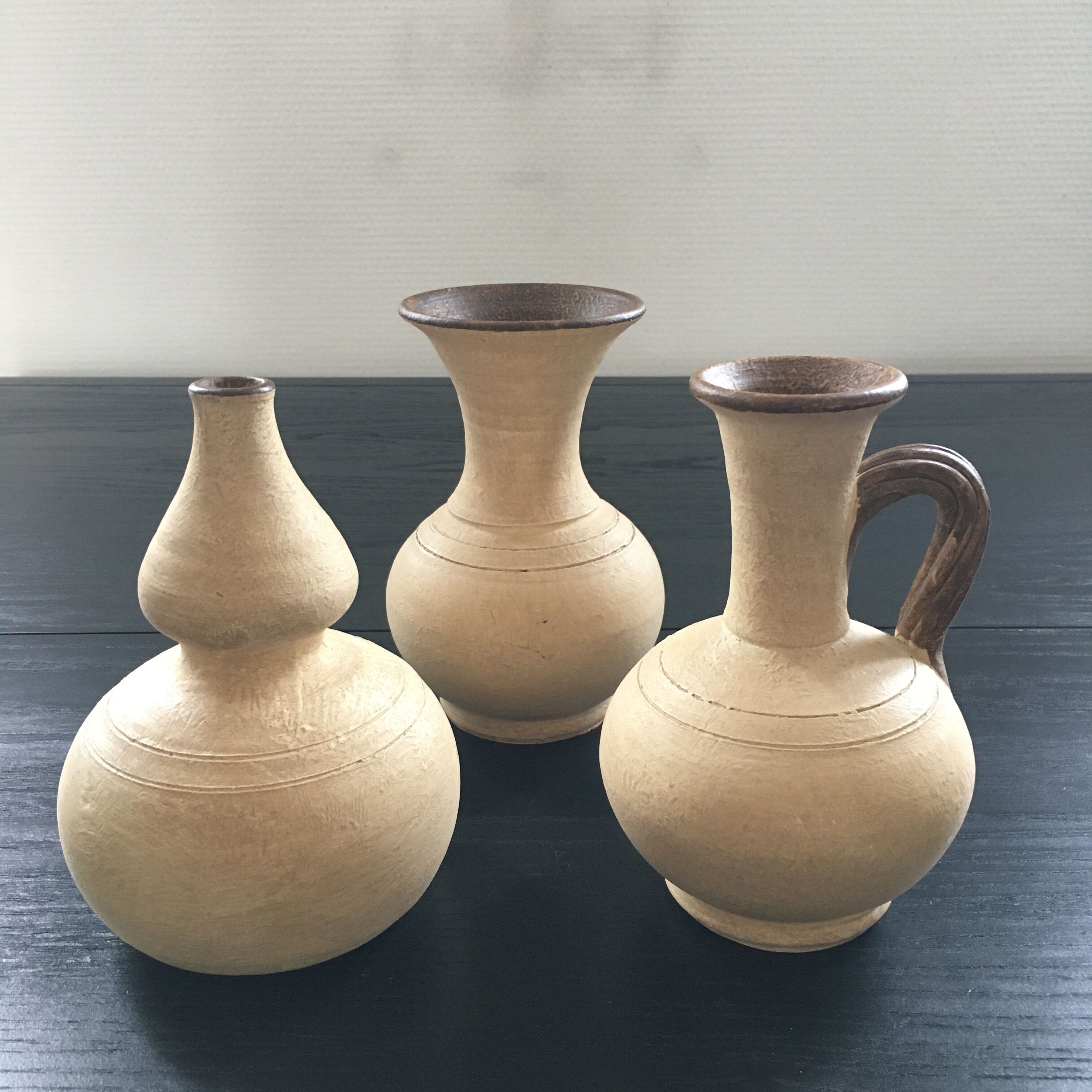 Trio of terracotta vases