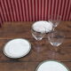 3 plates in white porcelain and green edging