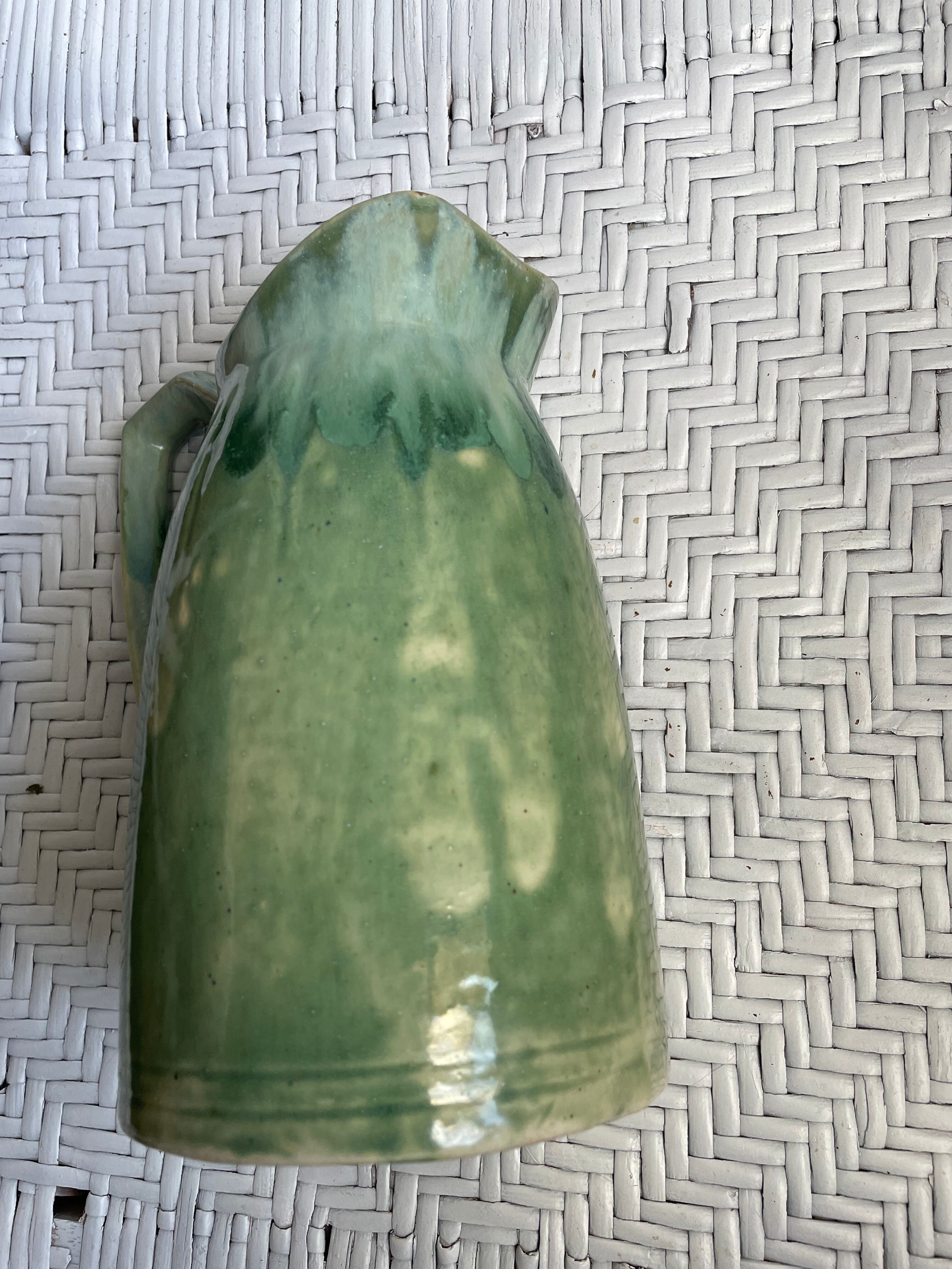 Turquoise green enamelled ceramic pitcher