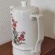Small coffee maker with floral decoration