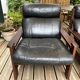 Vintage Scandinavian armchairs in leather and solid wood.