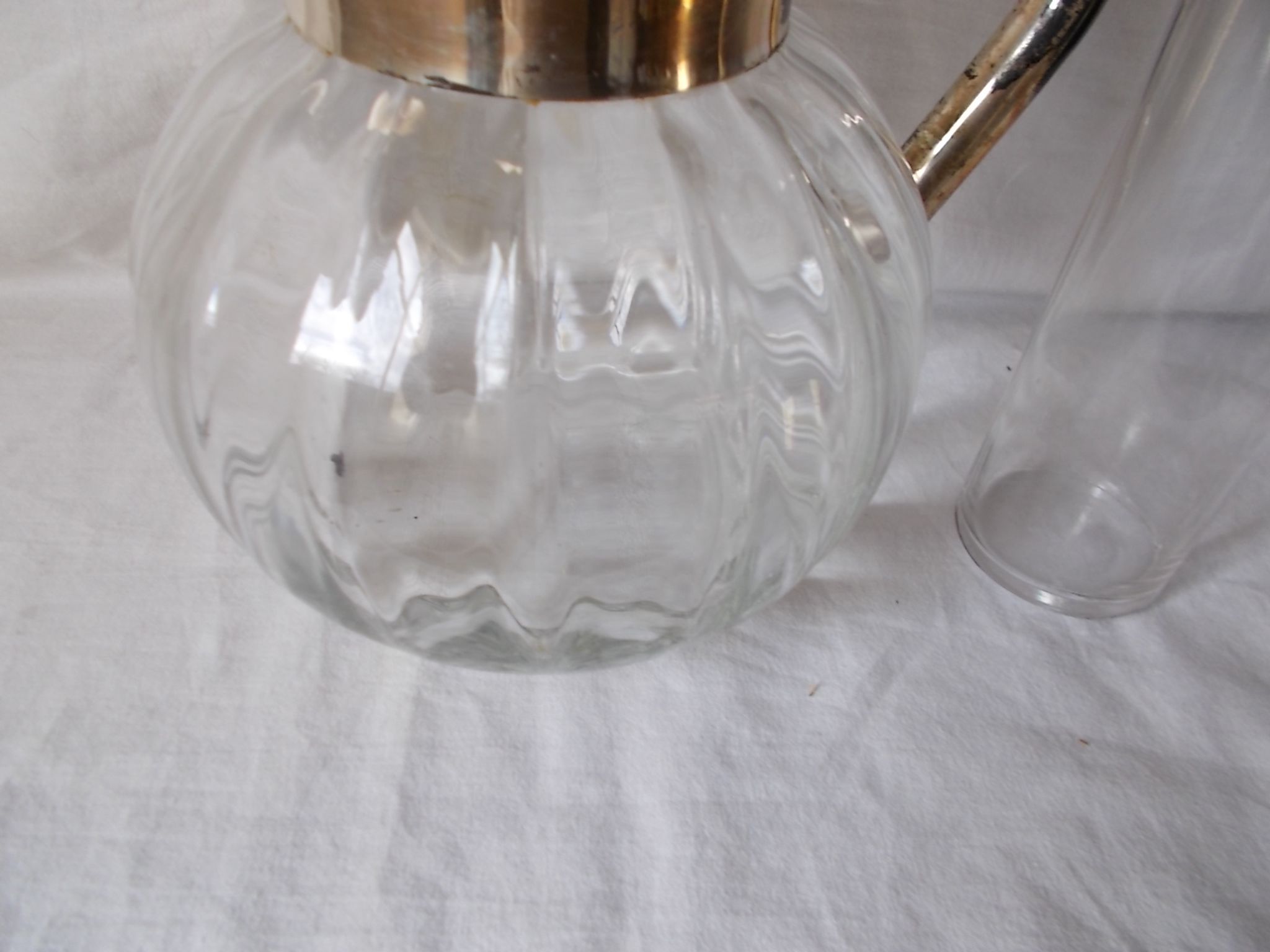 Lemonade and orangeade pitcher with ice reserve.