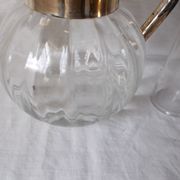 Lemonade and orangeade pitcher with ice reserve.