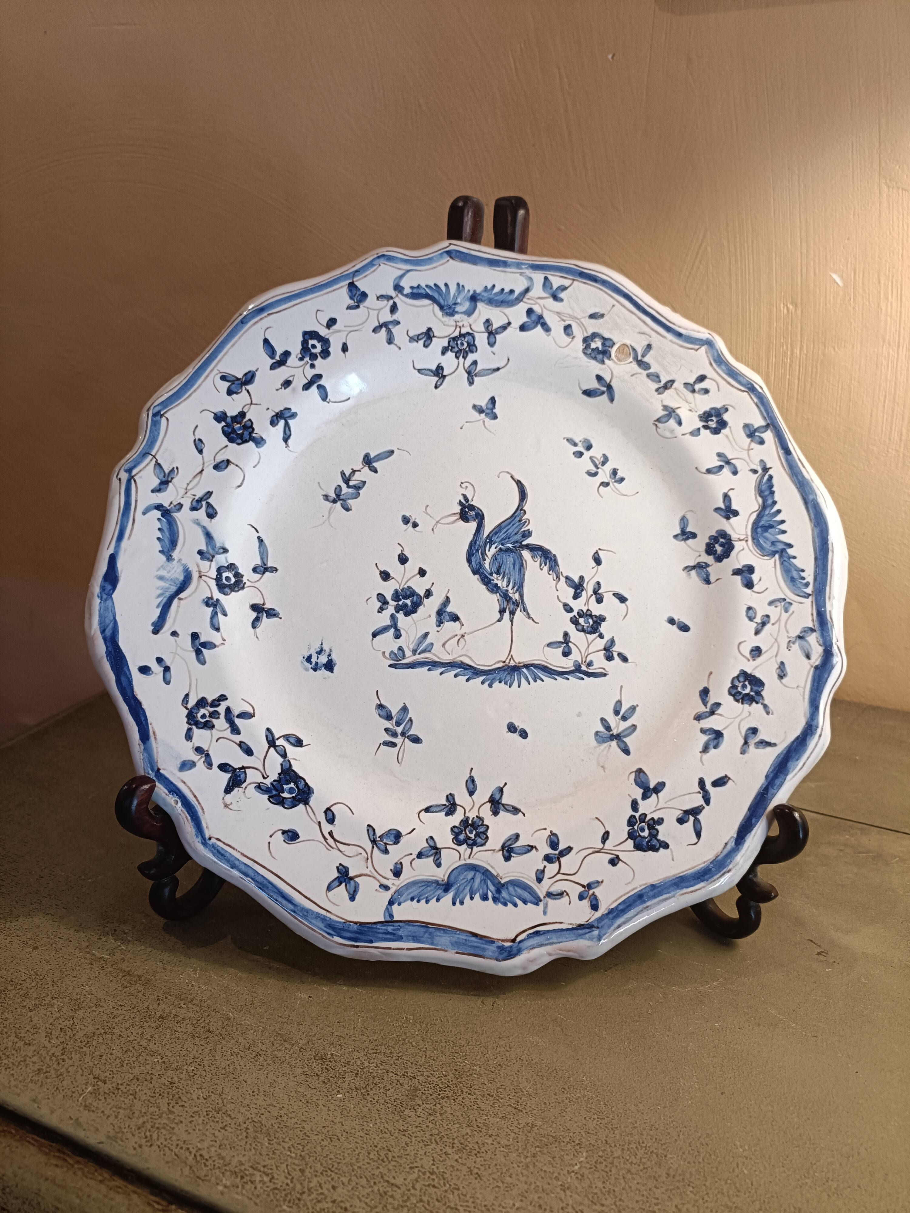 Old Moustiers faience plate blue and white with blue ibis decoration.