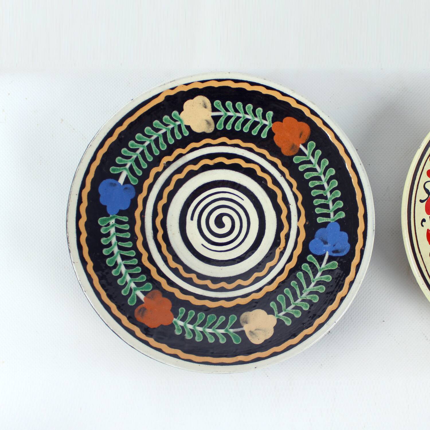 Set of three vintage folk art ceramic wall plates, Czechoslovakia and Romania.