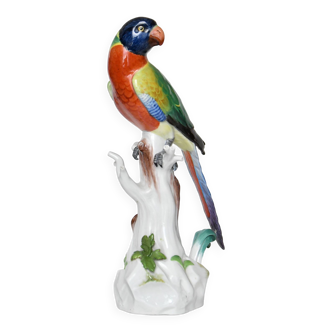 Meissen porcelain statuette representing a parrot sitting on a high tree trunk