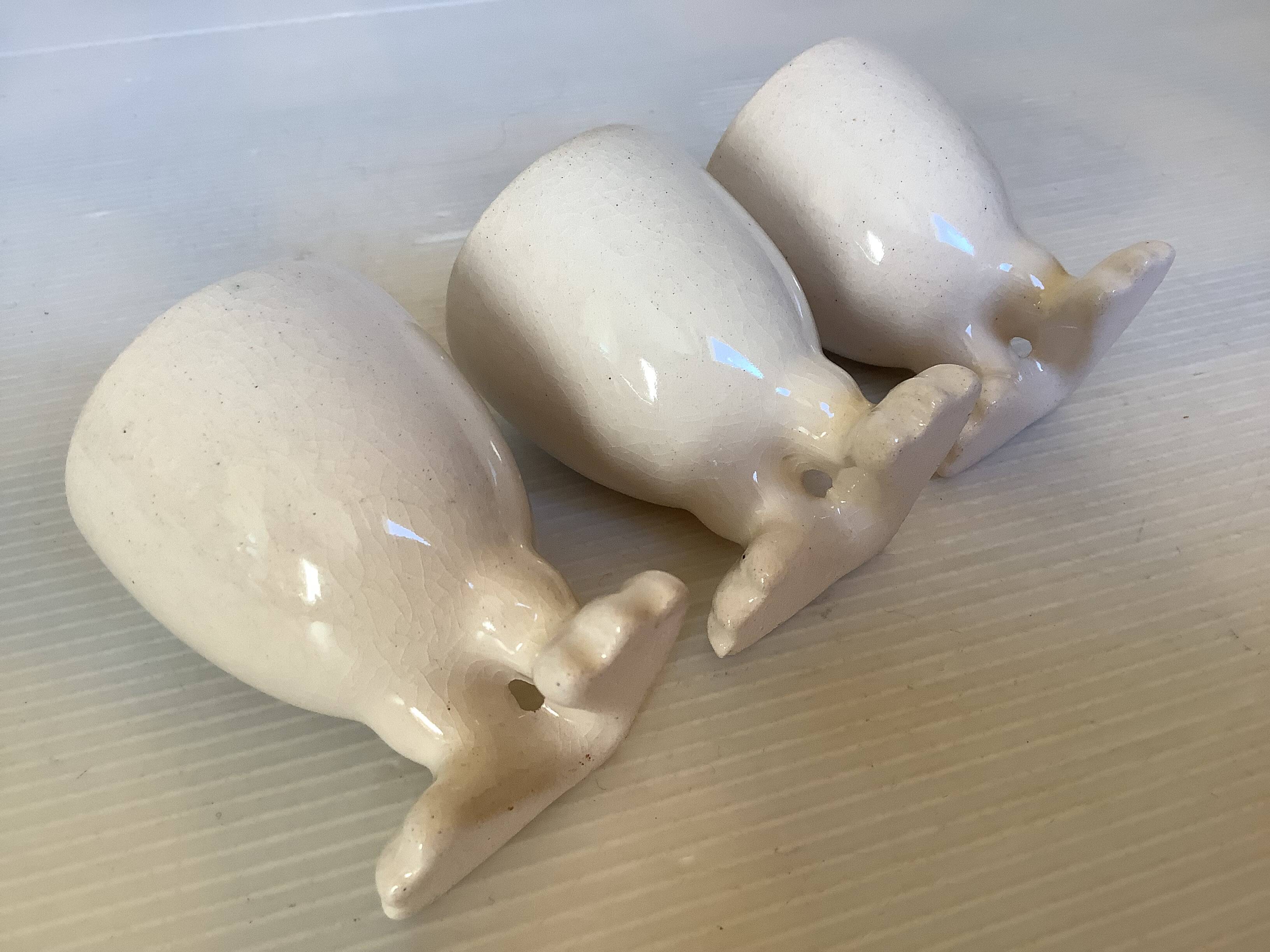 Set of cracked egg cups with feet