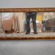 wall mirror in a decorative wooden frame.