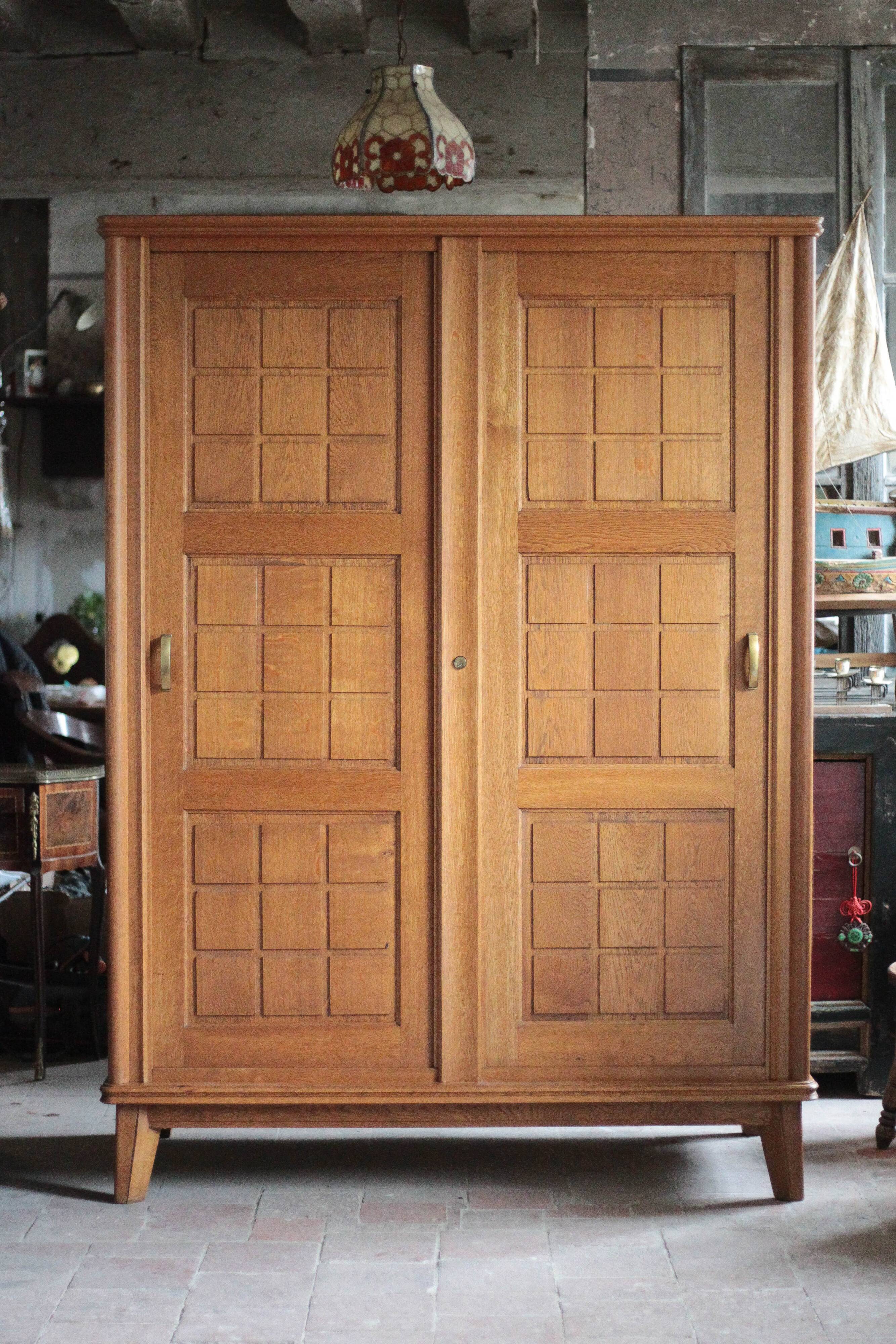 Vintage wooden wardrobe with sliding doors.