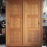 Vintage wooden wardrobe with sliding doors.