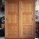 Vintage wooden wardrobe with sliding doors