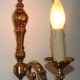 Simple wall sconce in classic Empire style in vintage French bronze.