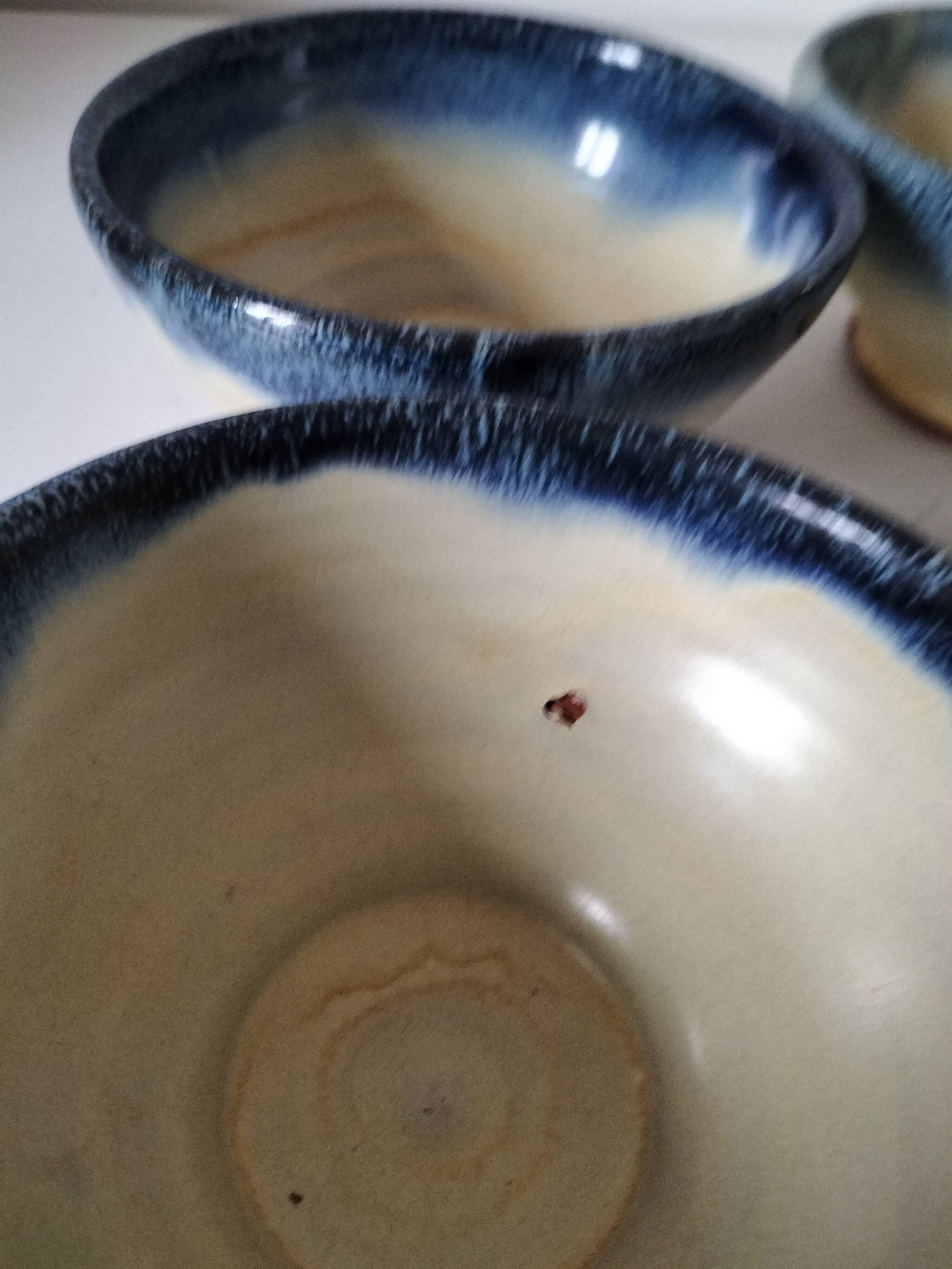 Set of 5 small blue and cream glazed stoneware bowls