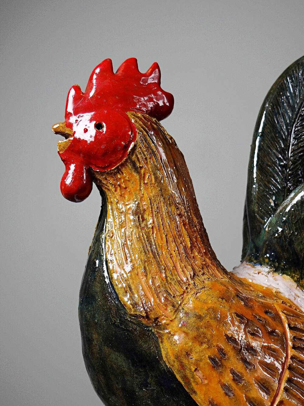 Small decorative rooster in handcrafted enameled ceramic folk art
