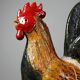 Small decorative rooster in handcrafted enameled ceramic folk art