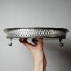 Small Moroccan tripod tea tray in silver-plated metal, vintage chiseled decoration.