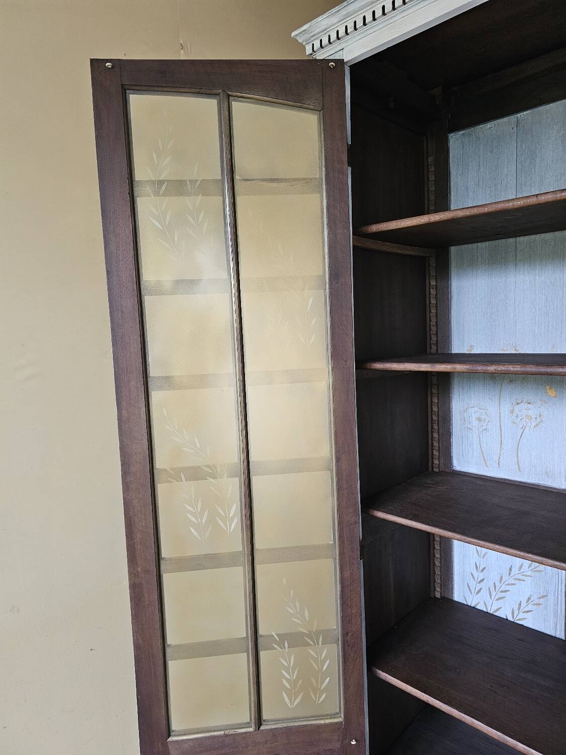 Antique bookcase with a white cerused patina