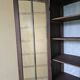 Antique library finished in white with a cerused effect.
