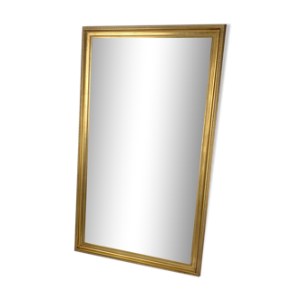 Miroir biseauté doré feuille XXème, 142x82 cm