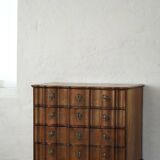 Antique baroque oak commode from the late 18th century with cabriole legs.