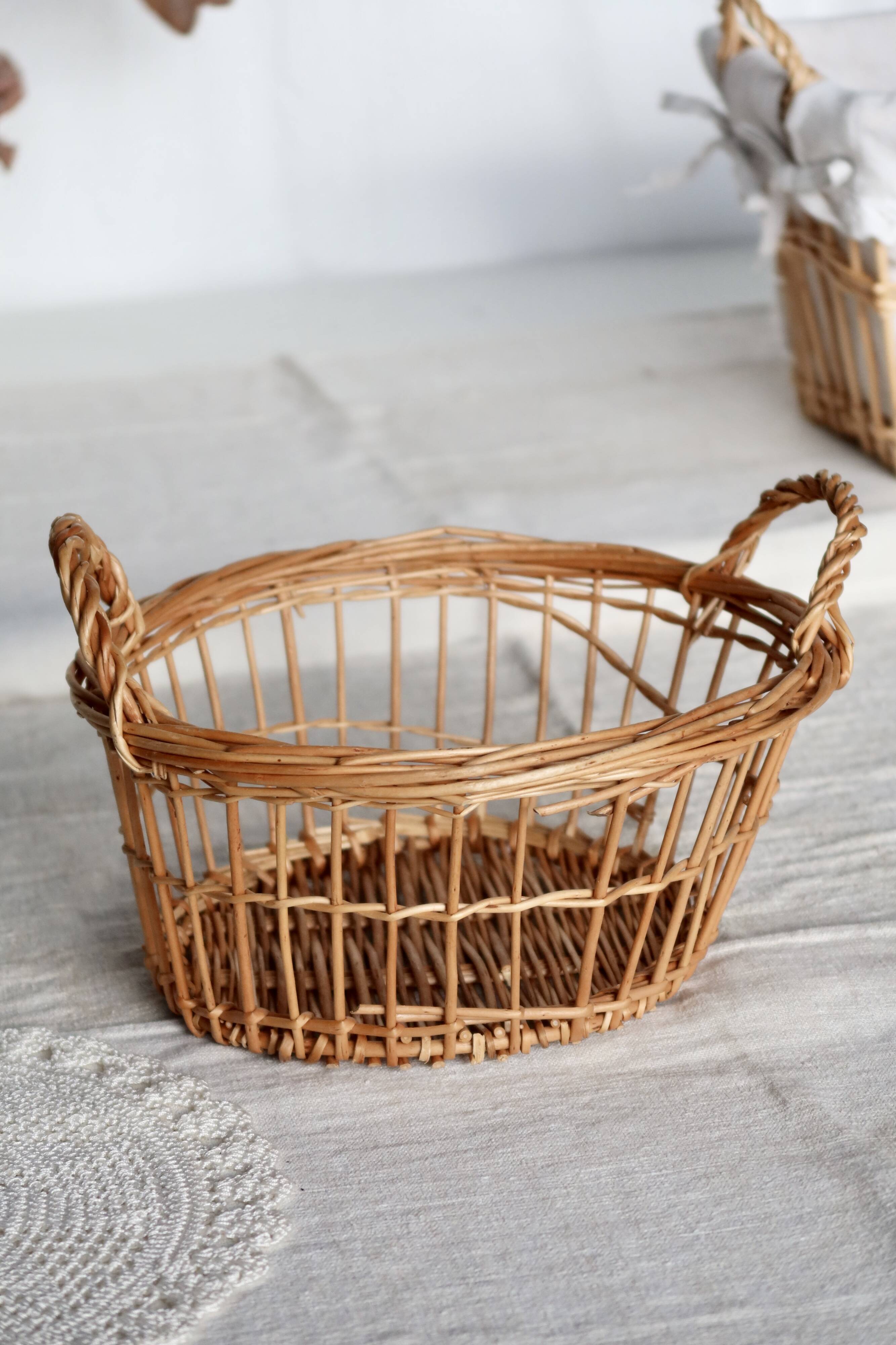 Round openwork wicker storage basket with braided handles