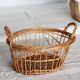 Round openwork wicker storage basket with braided handles