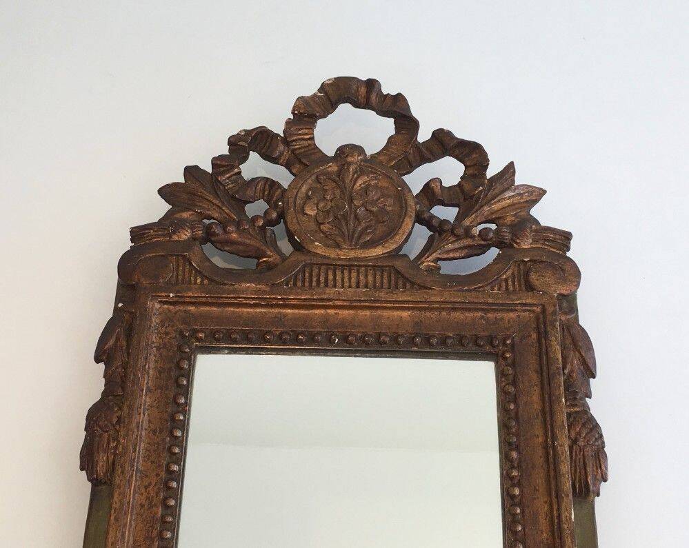Louis XVI style mirror in patinated and gilded wood